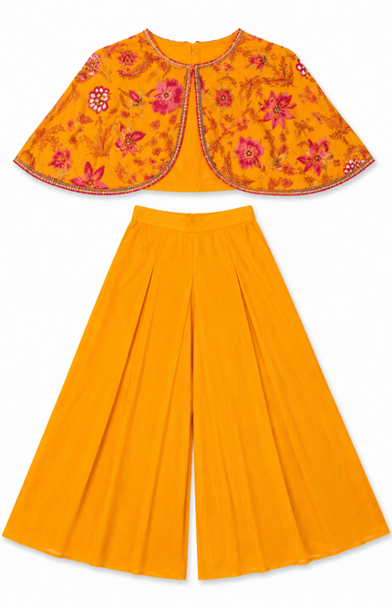 cape-style top paired with flowy wide-leg palazzo pants
